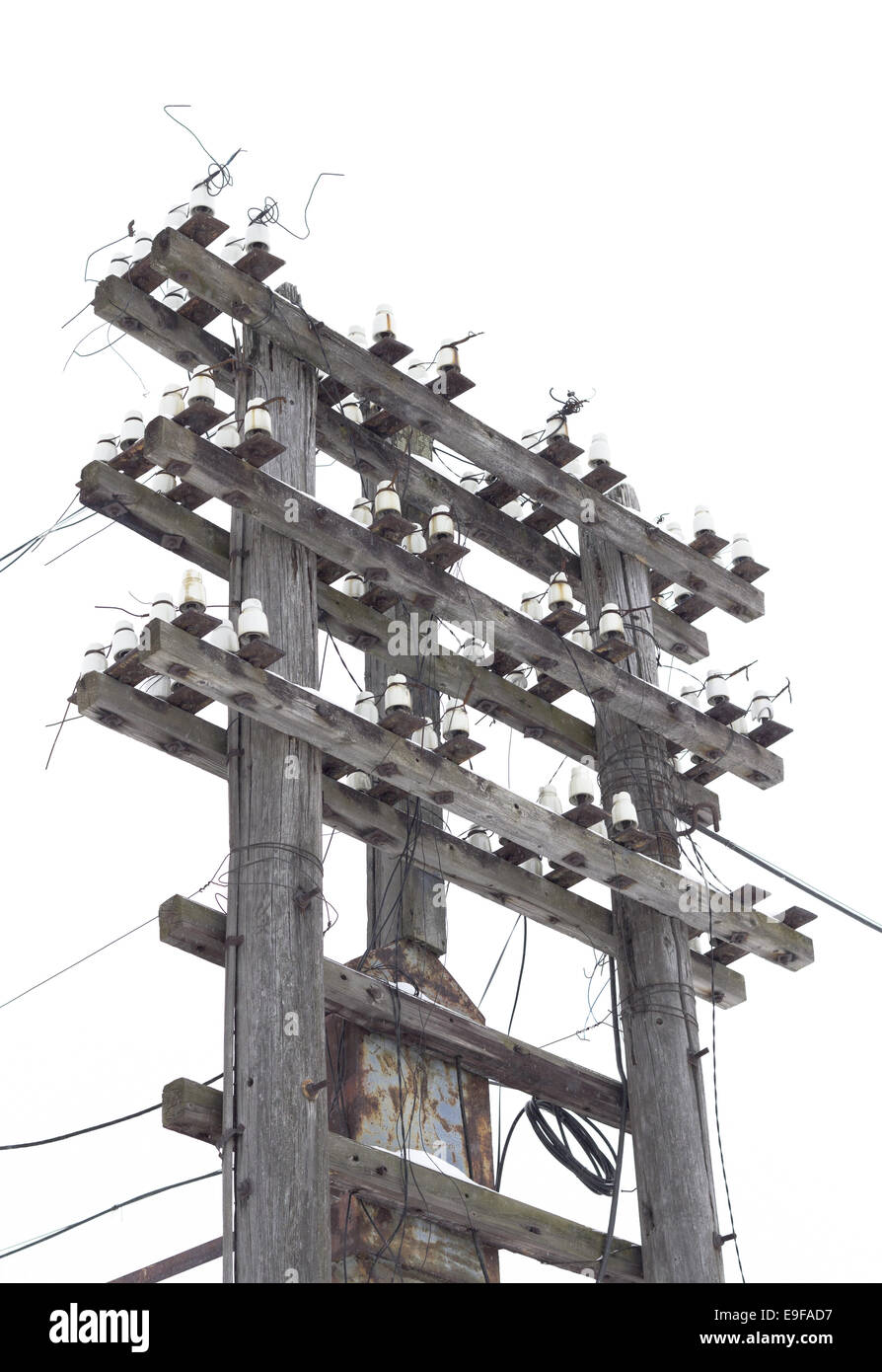 Old decrepit wooden telephone pole Stock Photo