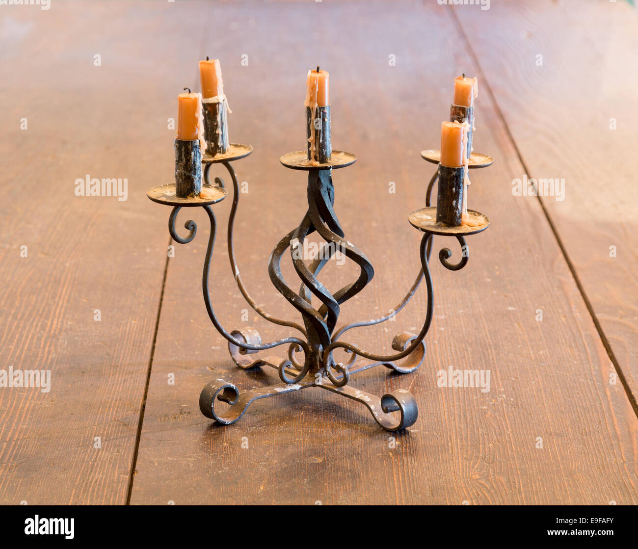 Old iron candlestick holder on table Stock Photo Alamy