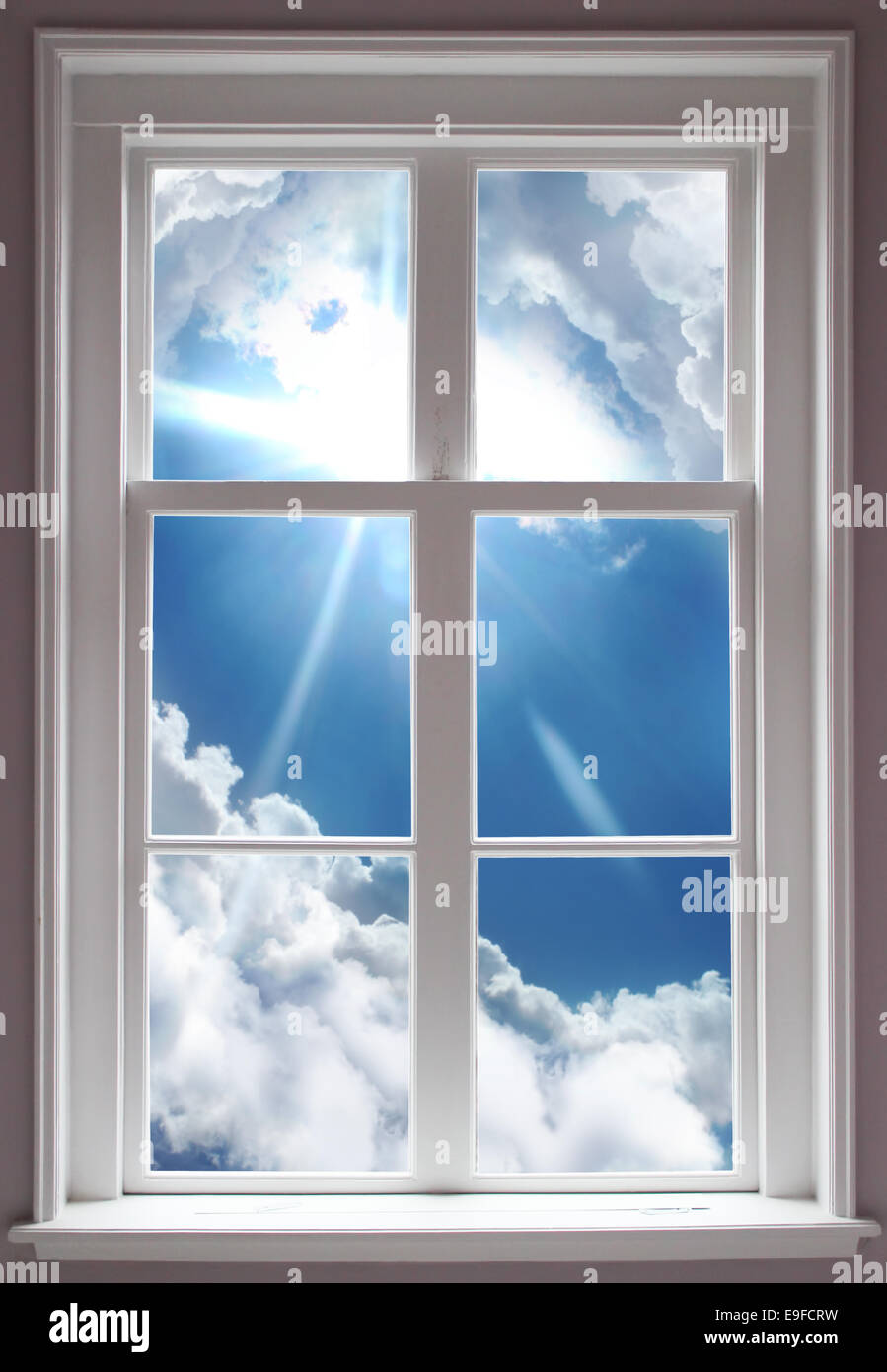 Blue cloudy sky seem through a window Stock Photo