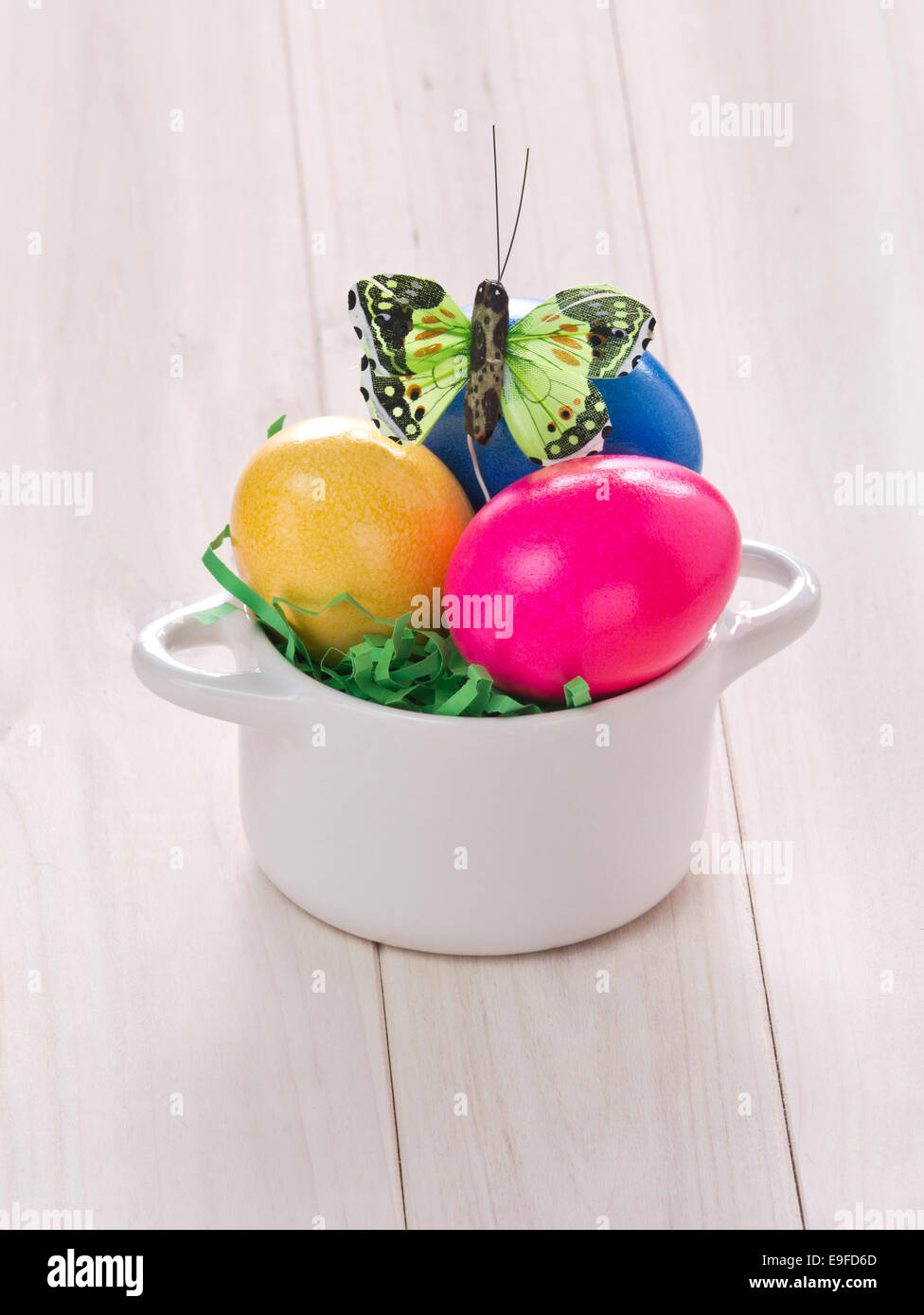 Colored eastereggs with a butterfly. Stock Photo