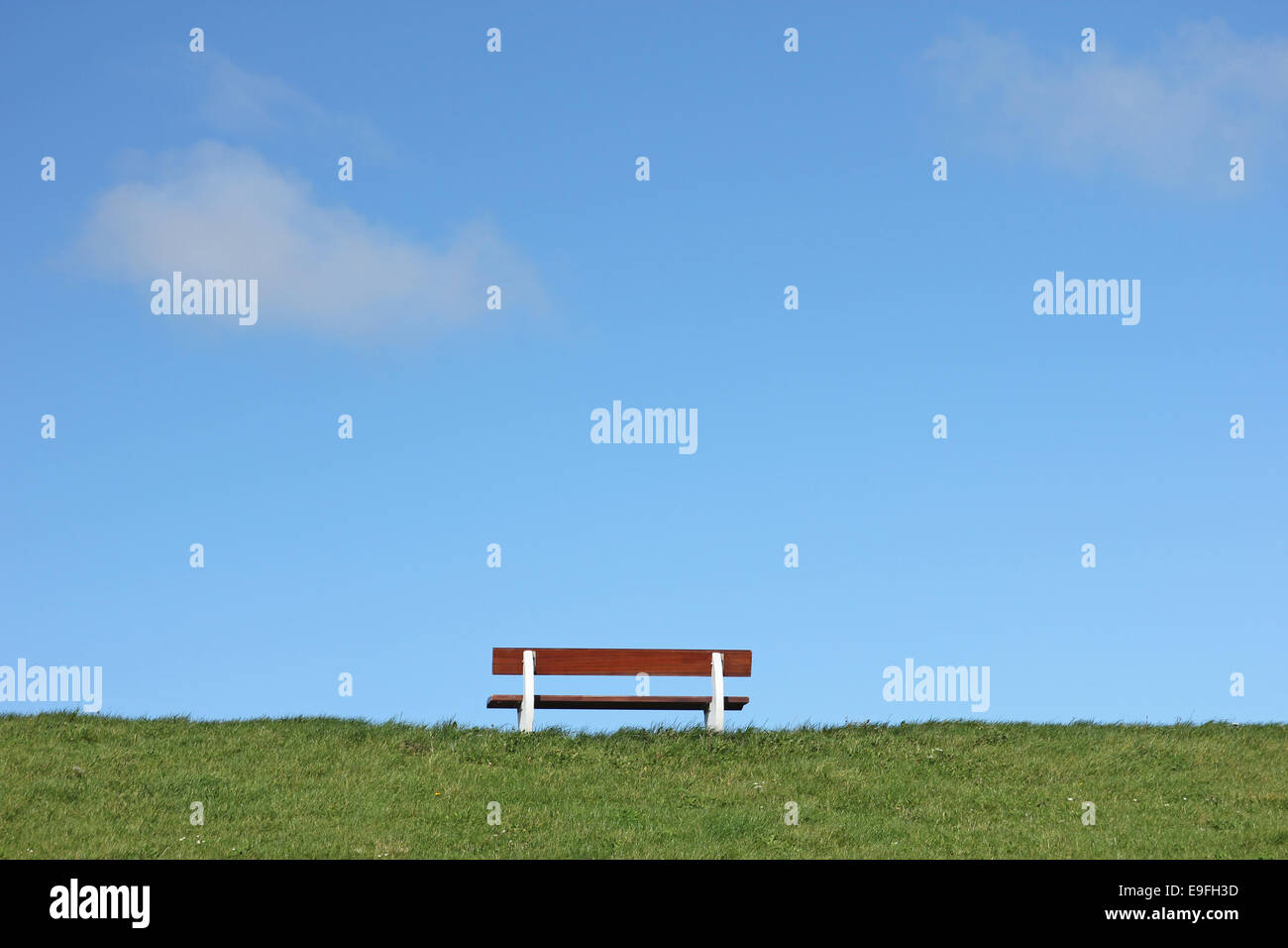 Bench on a dike at the North Sea Stock Photo