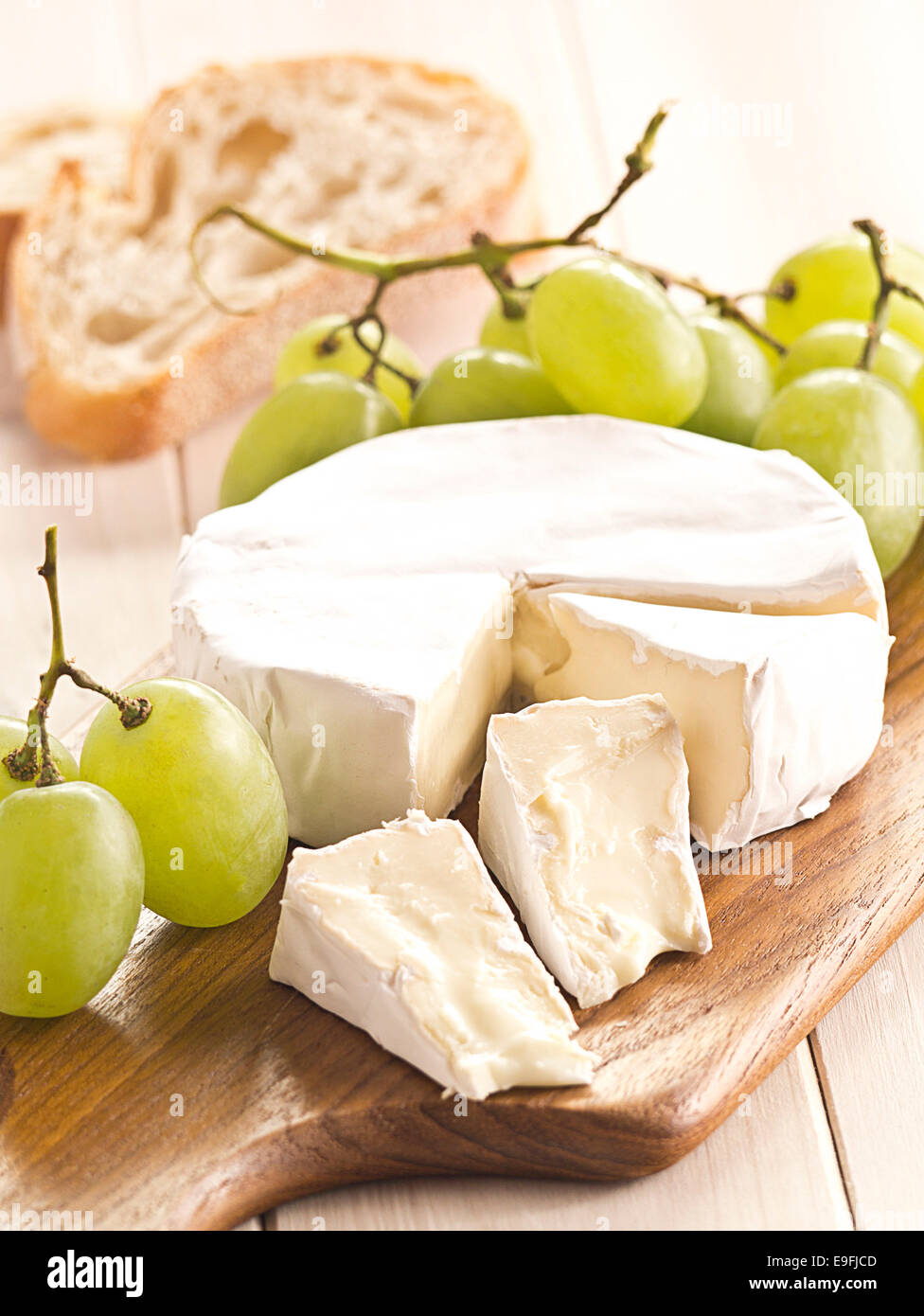 Cheese board with Camenbert and grapes Stock Photo