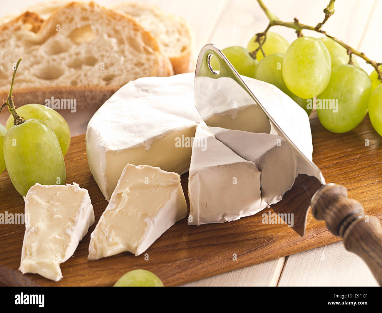 Cheese board with Camenbert and grapes Stock Photo
