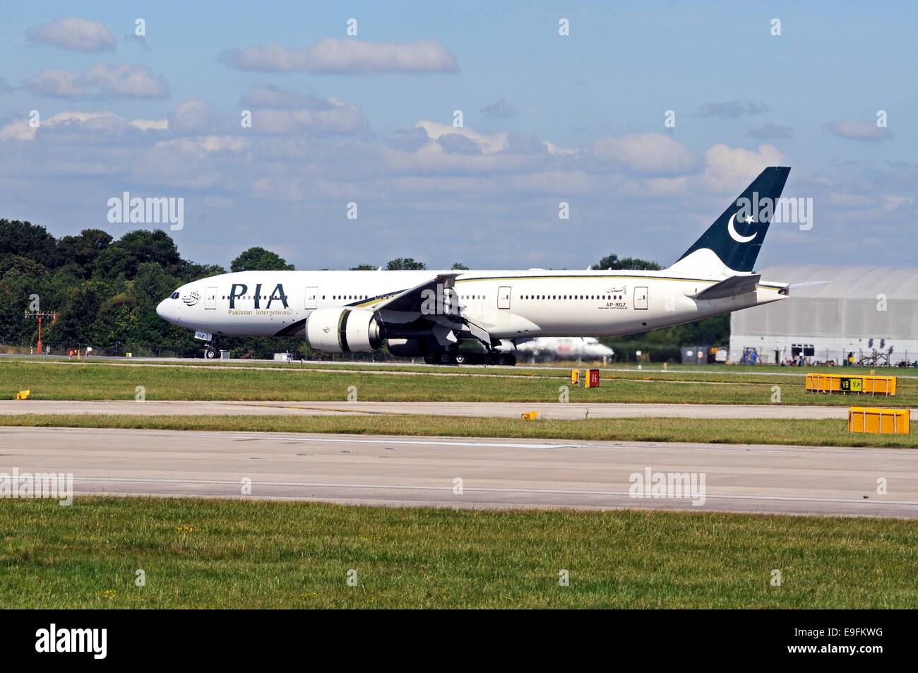 Pakistan International Airways Boeing 777-240LR taxiing at Manchester airport, Manchester, Greater Manchester, England, UK. Stock Photo