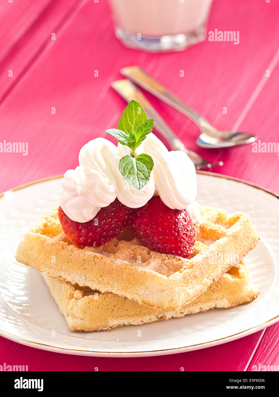 Waffles with strawberries and whipped cre Stock Photo - Alamy