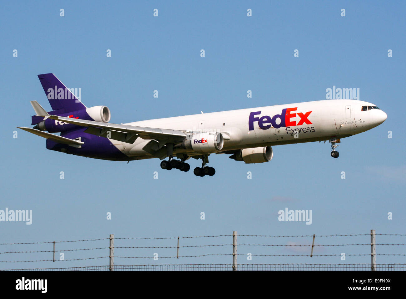 FedEx McDonnell Douglas MD-11 approaches runway 23 at London Stansted airport. Stock Photo