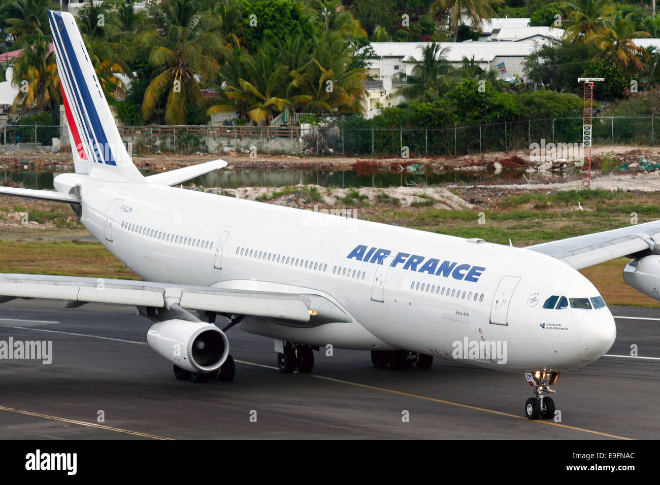 Air France Airbus A340-300 taxis into position for takeoff at St. Maarten airport. Stock Photo