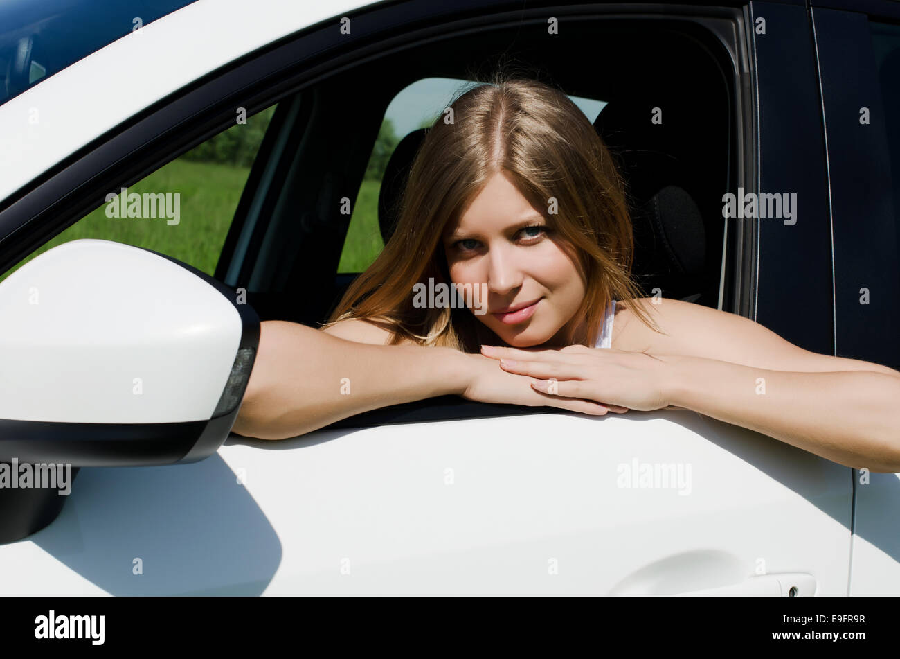 The beautiful girl at the wheel the car Stock Photo