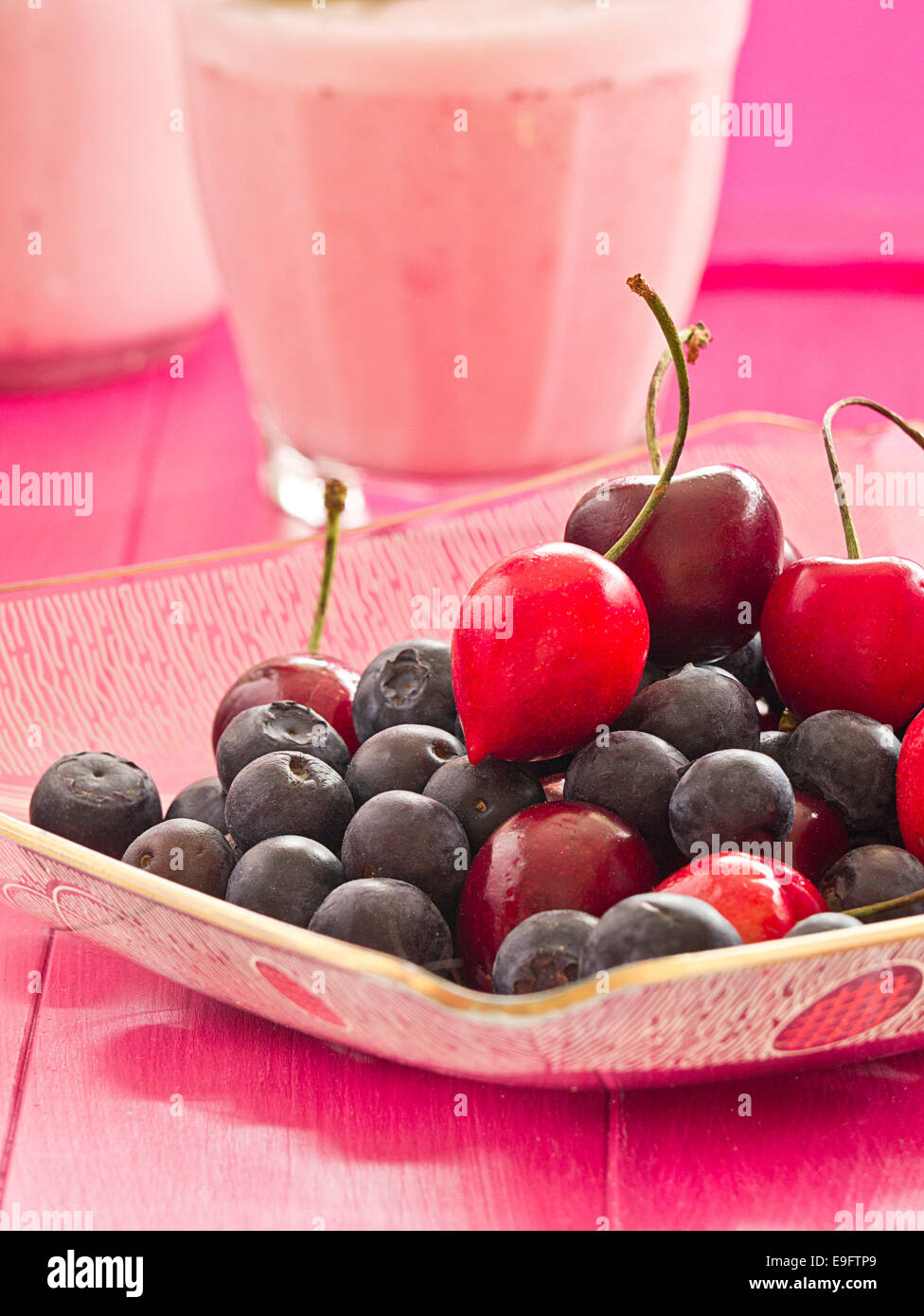 Blueberries and cherries in a bowl Stock Photo Alamy