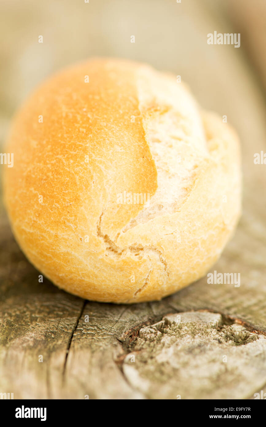 Bread bun on wooden table close up Stock Photo