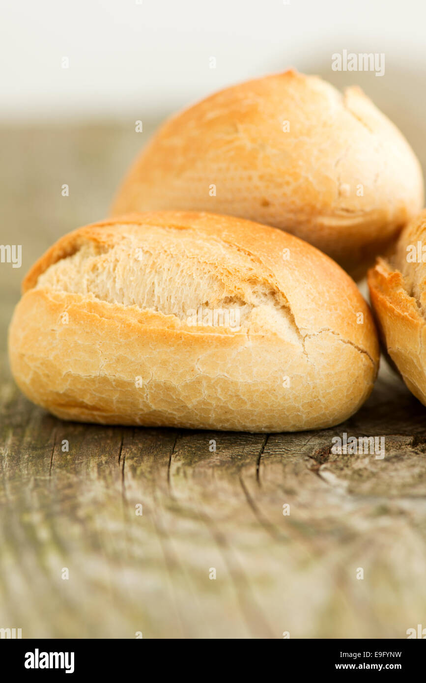 Bread on wooden table close up Stock Photo - Alamy