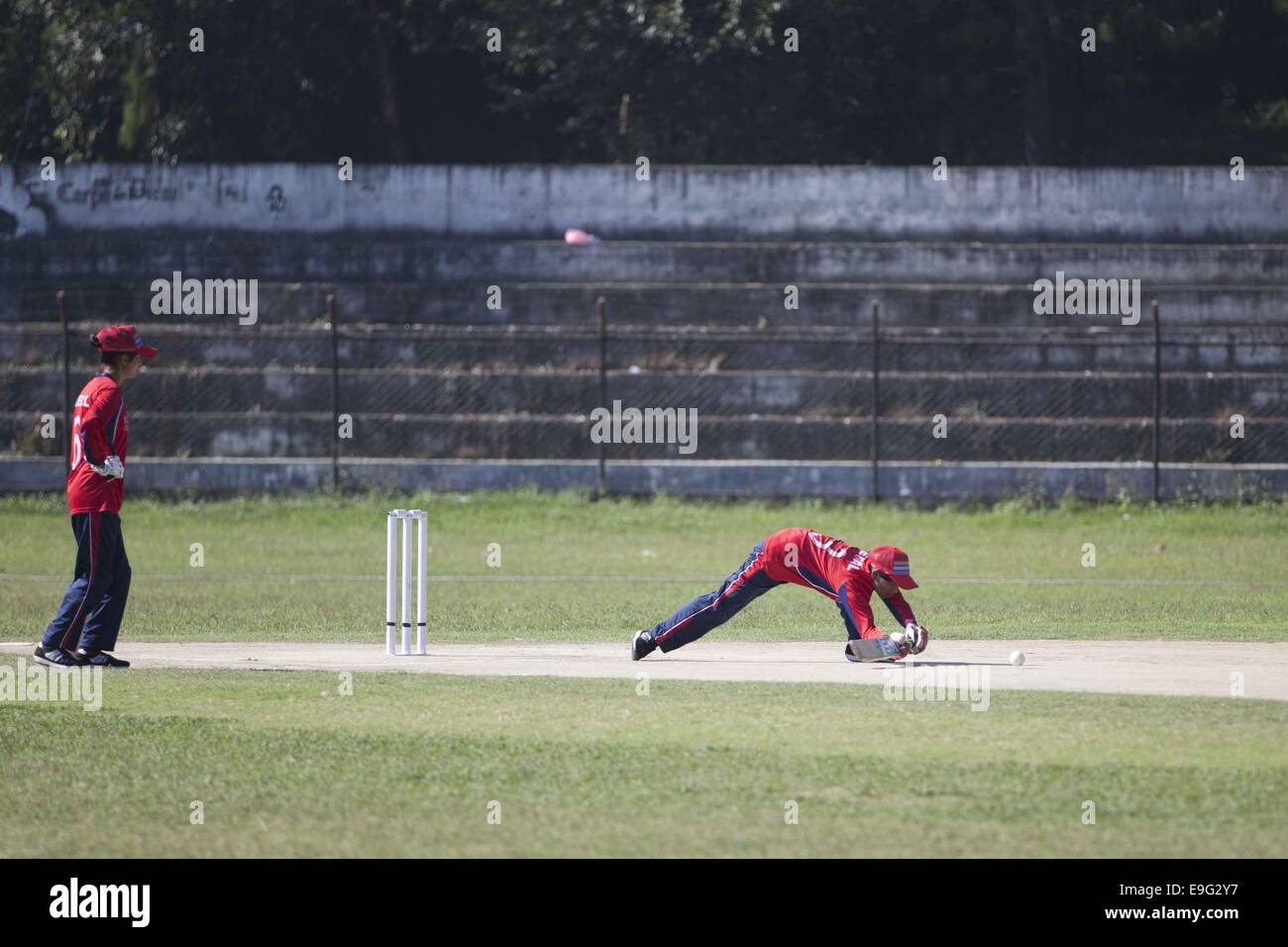 Lalitpur, Nepal. 27th Oct, 2014. Visually impaired Nepali women cricketers compete during a match of International Blind Women Cricket Tournament in Lalitpur, Oct. 27, 2014. Credit:  Pratap Thapa/Xinhua/Alamy Live News Stock Photo