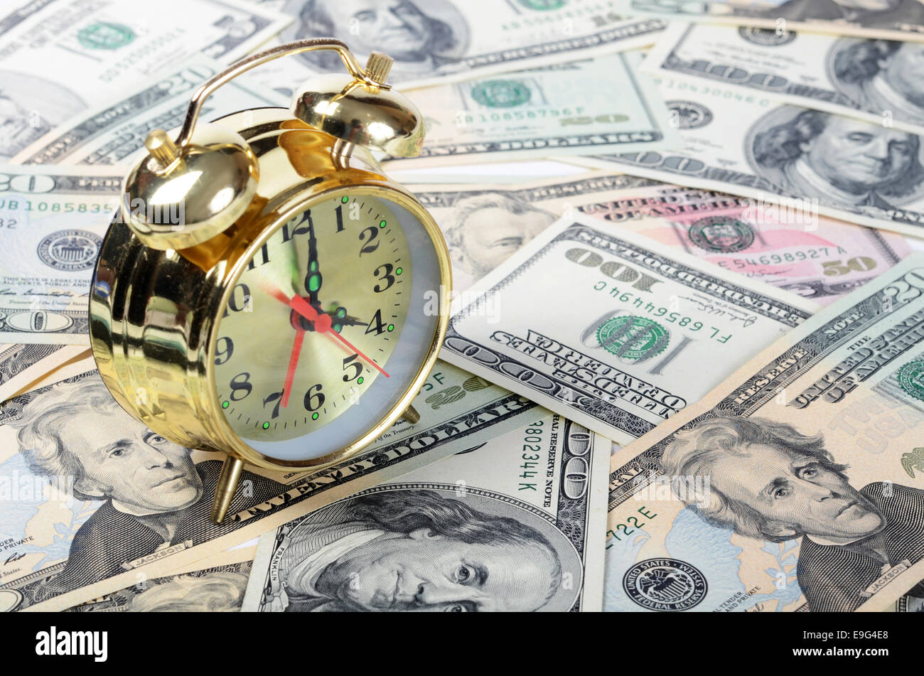 Alarm clock for dollar banknotes Stock Photo Alamy