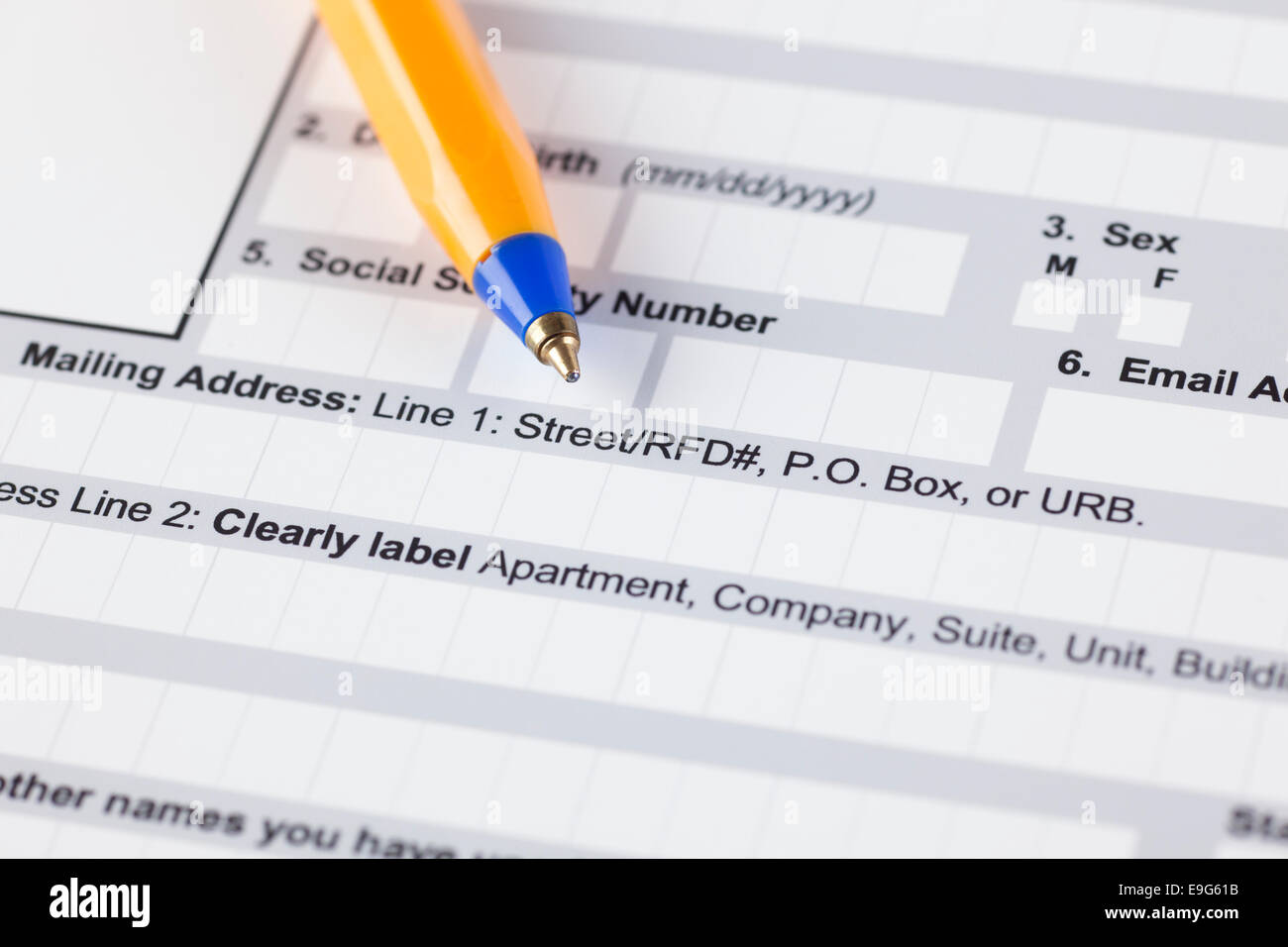 Application form with ballpoint pen. Focus on mailing address line. Stock Photo