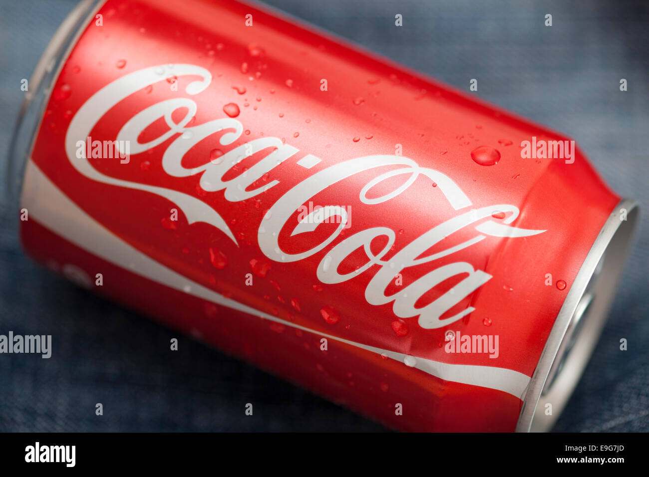 Tambov, Russian Federation - March 14, 2011 Coca-Cola can with water droplets on denim background. Studio shot. Stock Photo