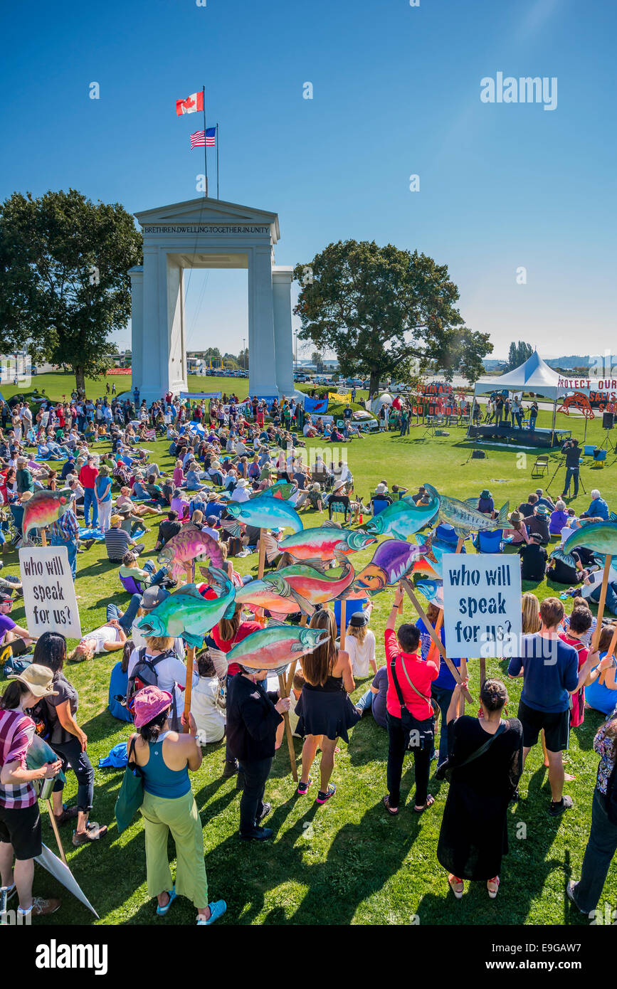 Climate Change Knows No Borders. International rally at Peace Arch U.S Canada border crossing. Stock Photo