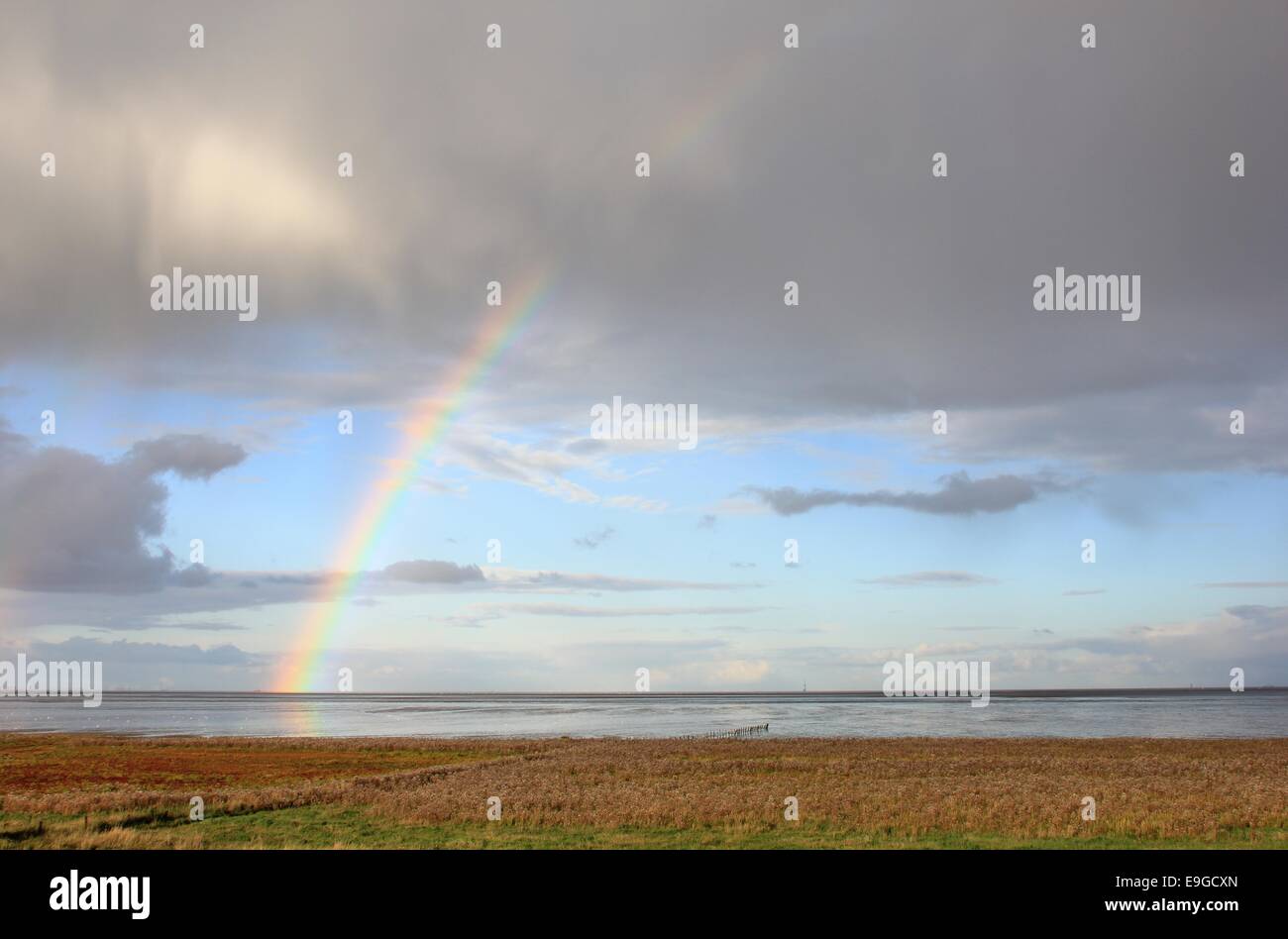 Rainbow over the wadden sea Stock Photo