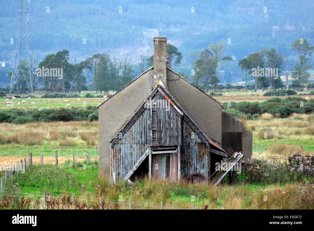 Derelict farmhouse set amongst farmland at the Bonar Bridge, Scottish