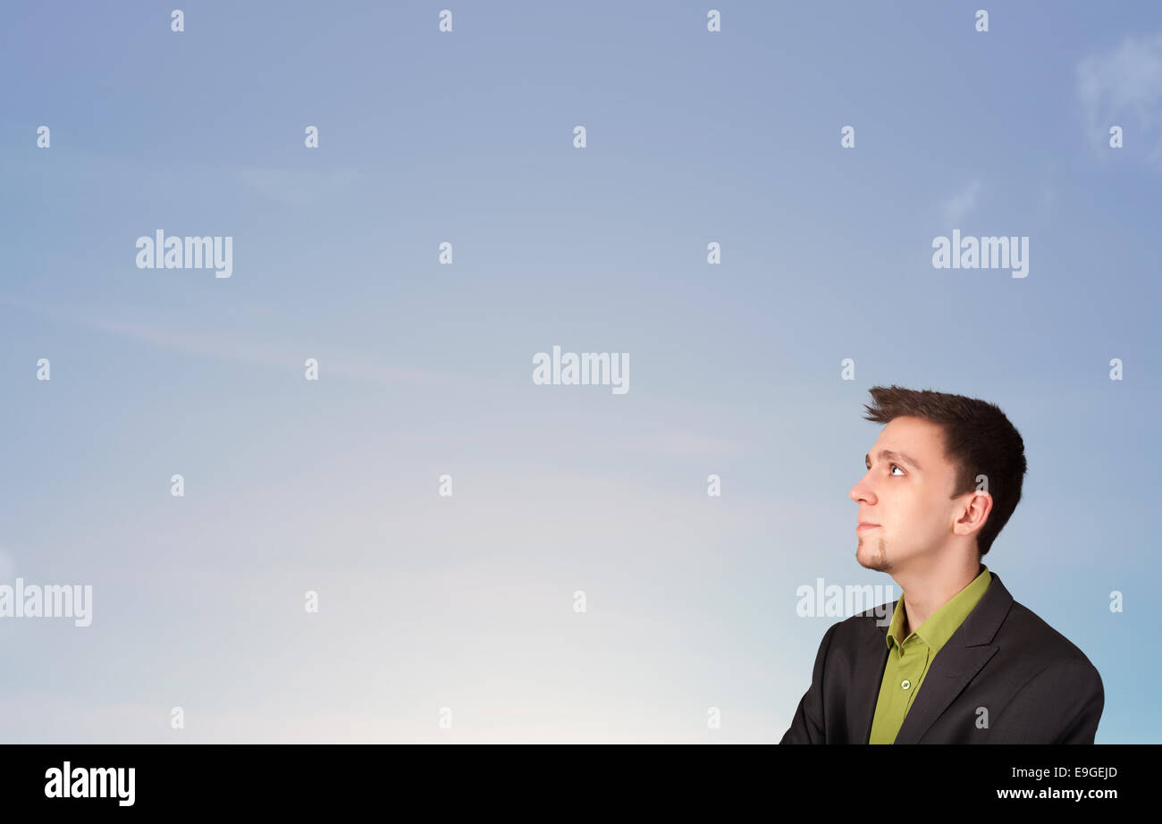 Handsome man looking at the blue sky copyspace Stock Photo - Alamy