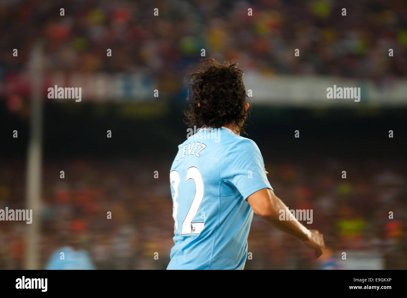 BARCELONA - AUG 19: Carlos Tevez, Manchester City player, plays against Carles Puyol, of F.C Barcelona. Joan Gamper Throphy. Stock Photo