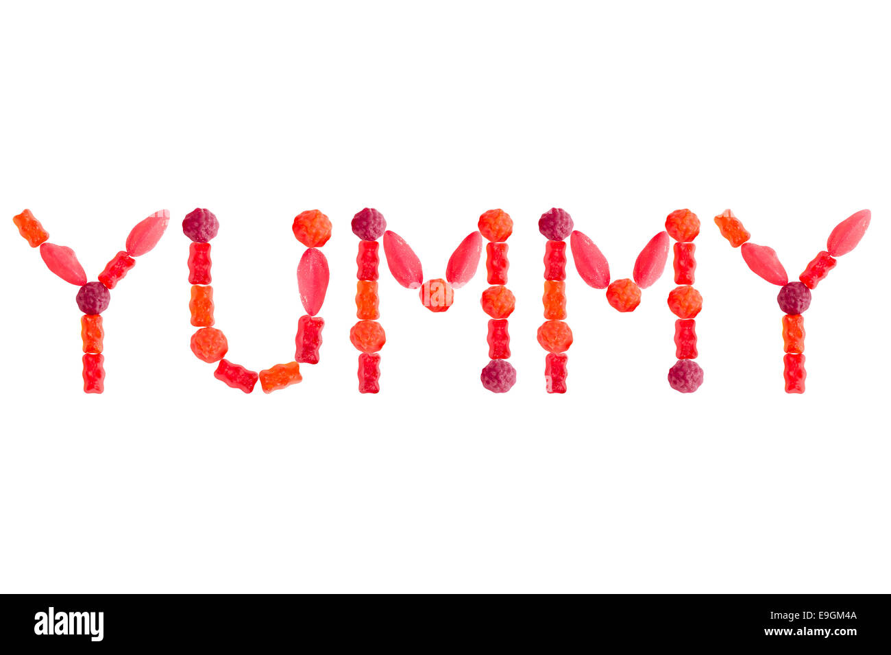 Word YUMMY made of red sugary candies, isolated on white background Stock Photo