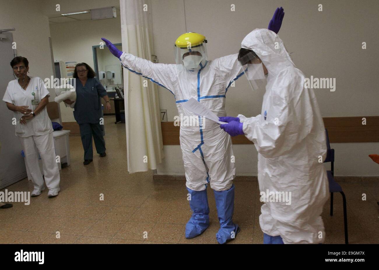 Jerusalem, Israel. 27th Oct, 2014. Israeli emergency workers attend a hospital exercise to treat 'patients infected with Ebola' at Kaplan hospital in Rehovot near Tel Aviv, Israel, on Oct. 27, 2014. Credit:  Gil Cohen Magen/Xinhua/Alamy Live News Stock Photo