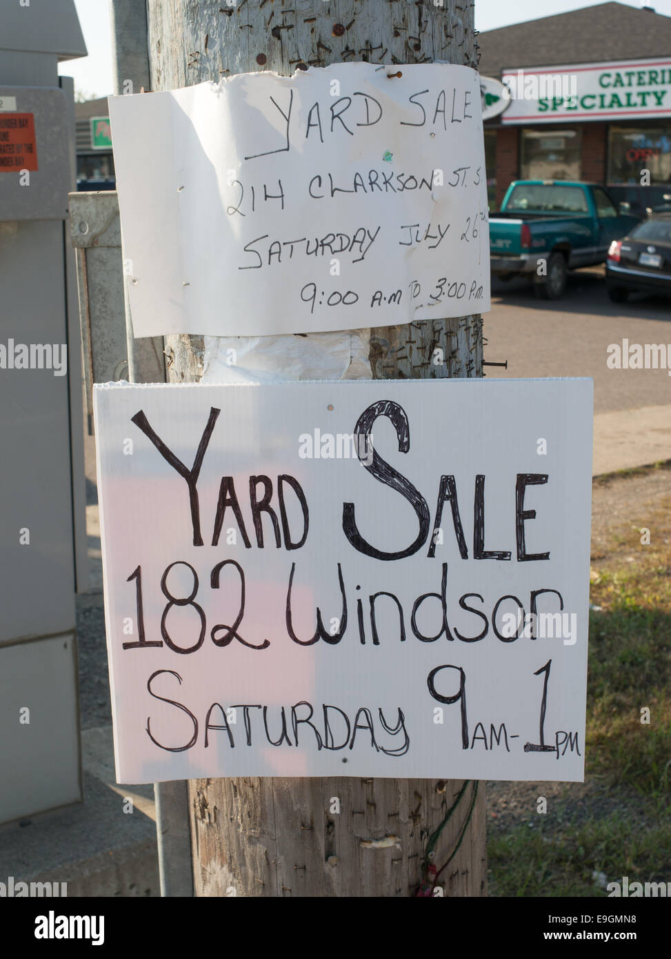 Handwritten signs advertising Yard Sales in Thunder Bay, Ontario, Canada Stock Photo