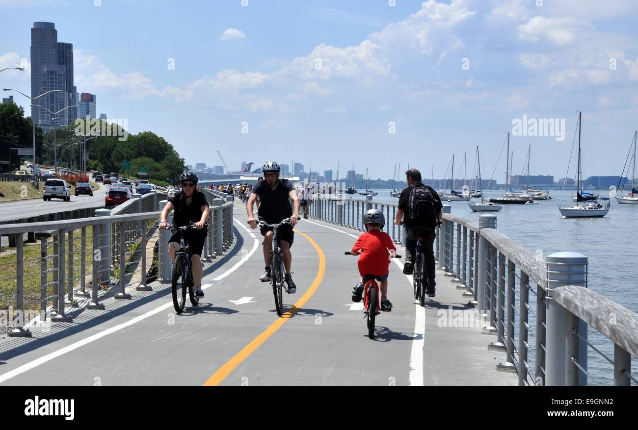 NYC:  Bicyclists enjoy a summer afternoon on the Hudson River bike path Stock Photo