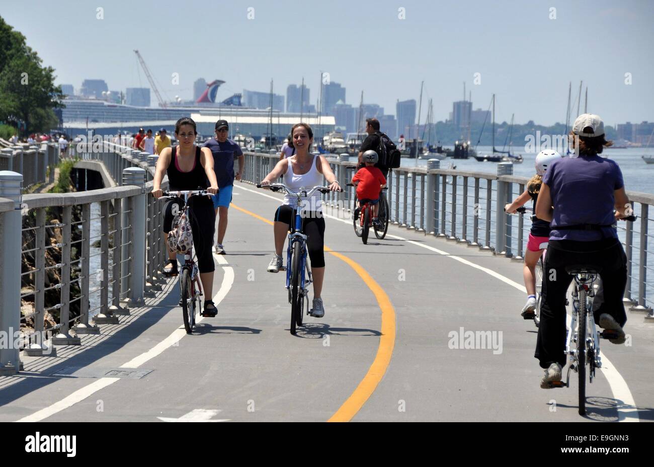 NYC Bicyclists enjoy a summer afternoon riding on the Hudson River