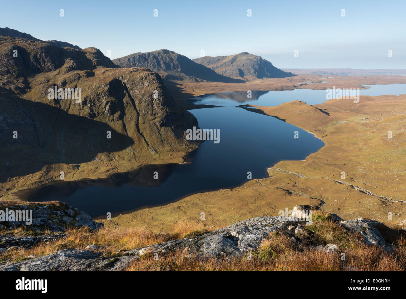 View over Dubh Loch and Fionn Loch from north west ridge of A' Mhaighdean, Letterewe Wilderness, Fisherfield Forest, Scotland Stock Photo