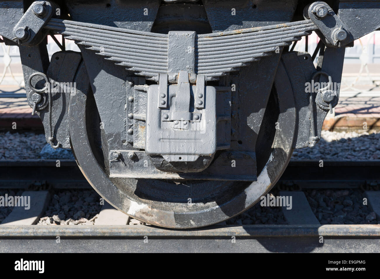 Closeup view of an old railway car wheels, leaf springs, journal boxes