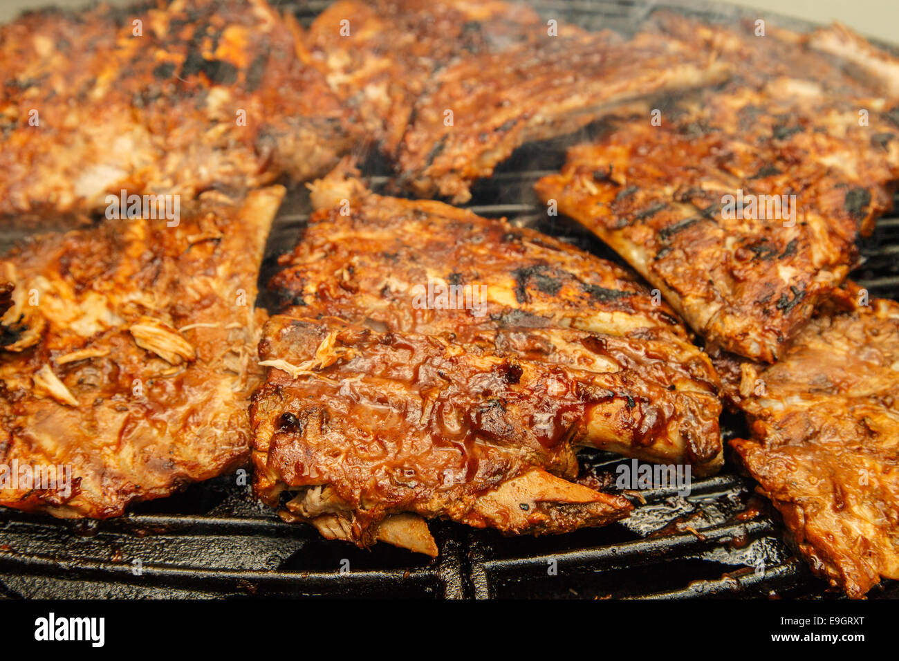 Babyback ribs being grilled Stock Photo