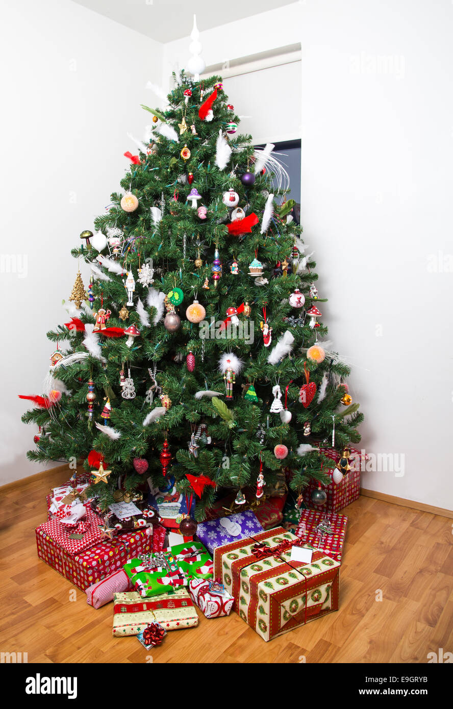 Decorated christmas tree with presents under it Stock Photo