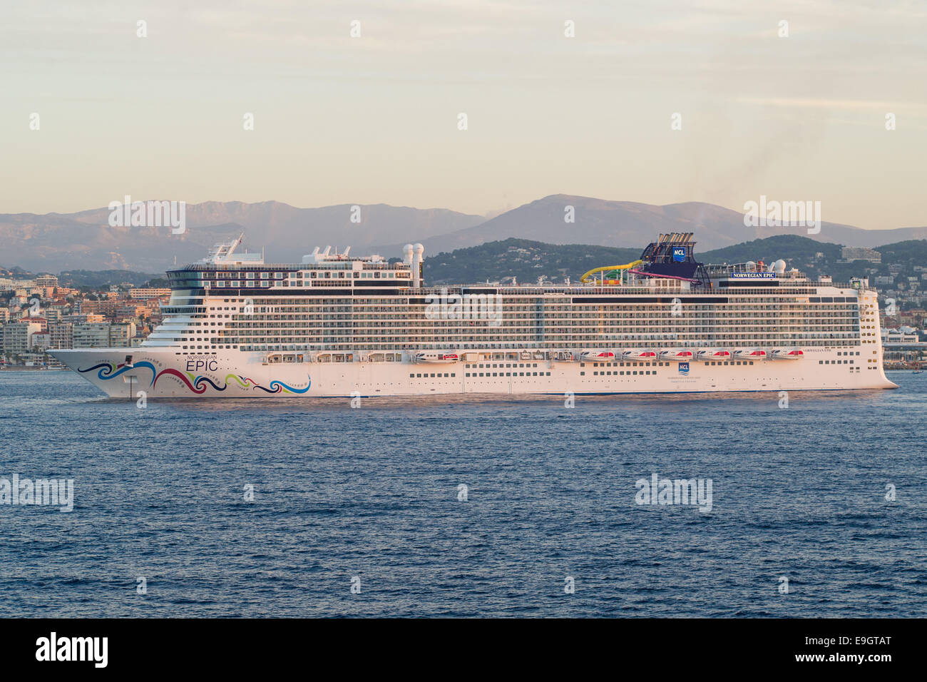 Norwegian Cruise Line's Norwegian Epic anchored off the coast of Cannes, France. Passengers disembarked via tender boats. Stock Photo