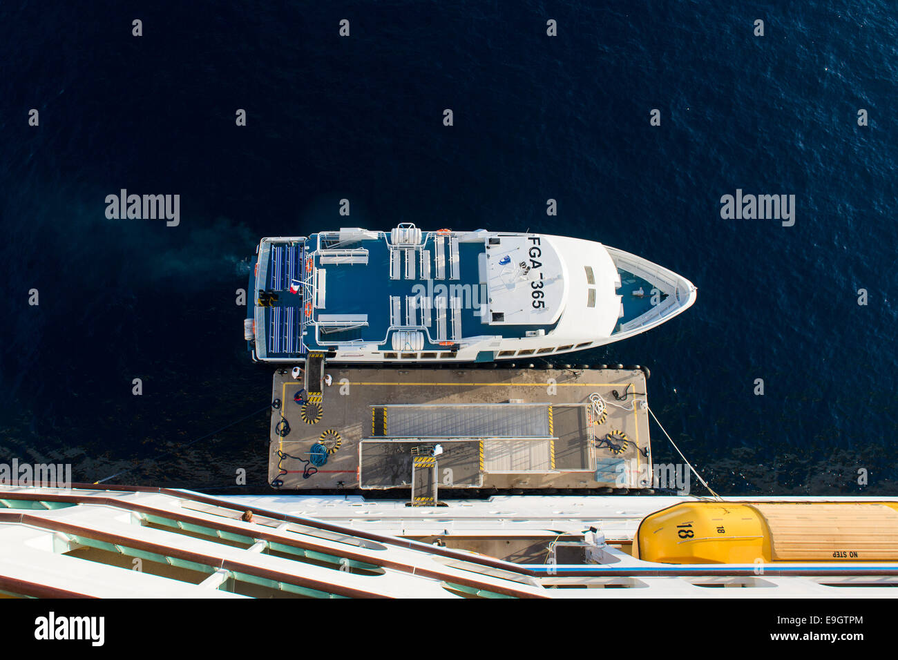 A tender boat awaits passengers to take to shore in Cannes, France, from Royal Caribbean's cruise ship Adventure Of The Seas Stock Photo
