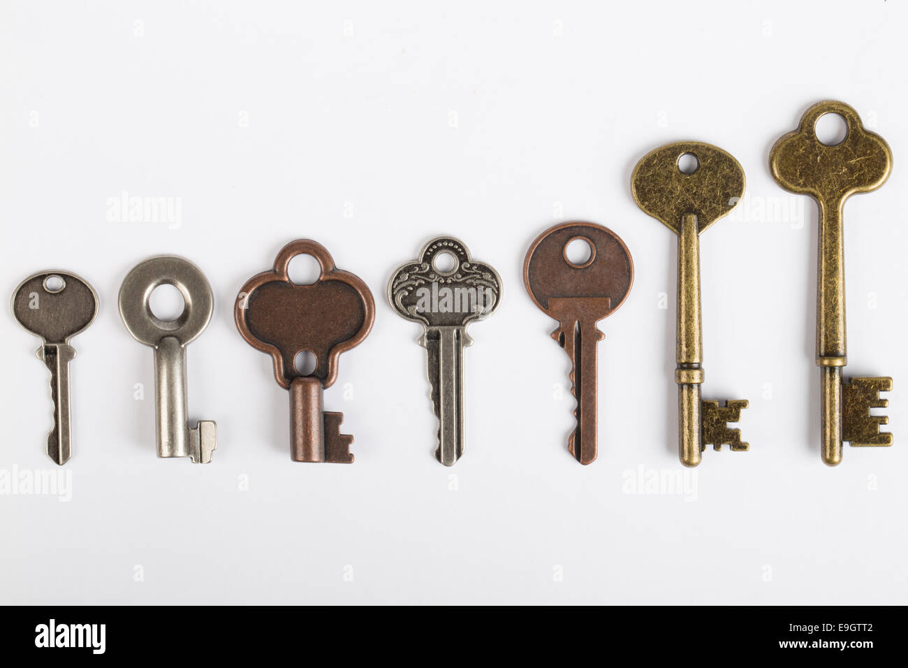Row of old fashioned keys isolated on white Stock Photo Alamy