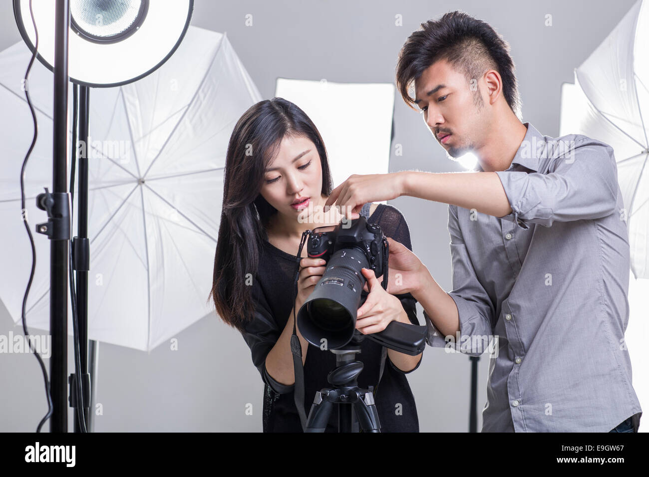 Two Photographers Working In Studio Stock Photo 74744383 - 