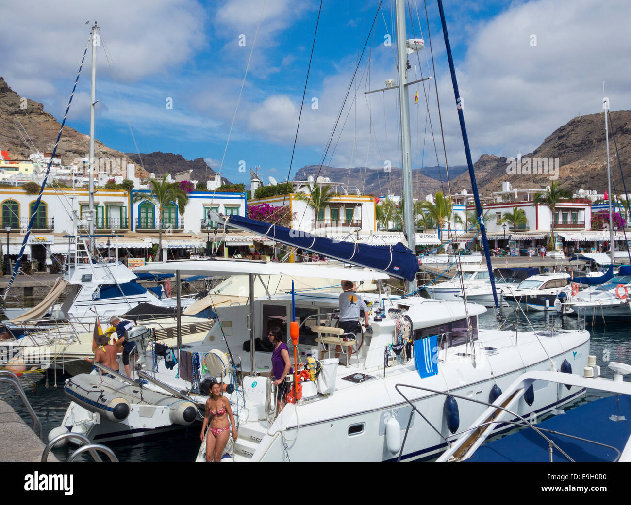 View over the marina and village towards mountains from Puerto de Mogan, Gran Canaria, Canary Islands, Spain Stock Photo