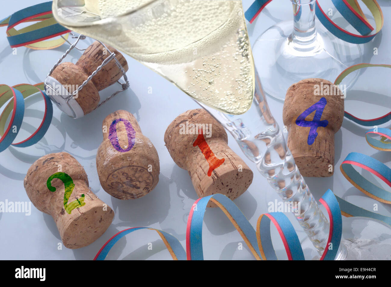 Champagne corks and champagne, New Years Eve 2014 Stock Photo