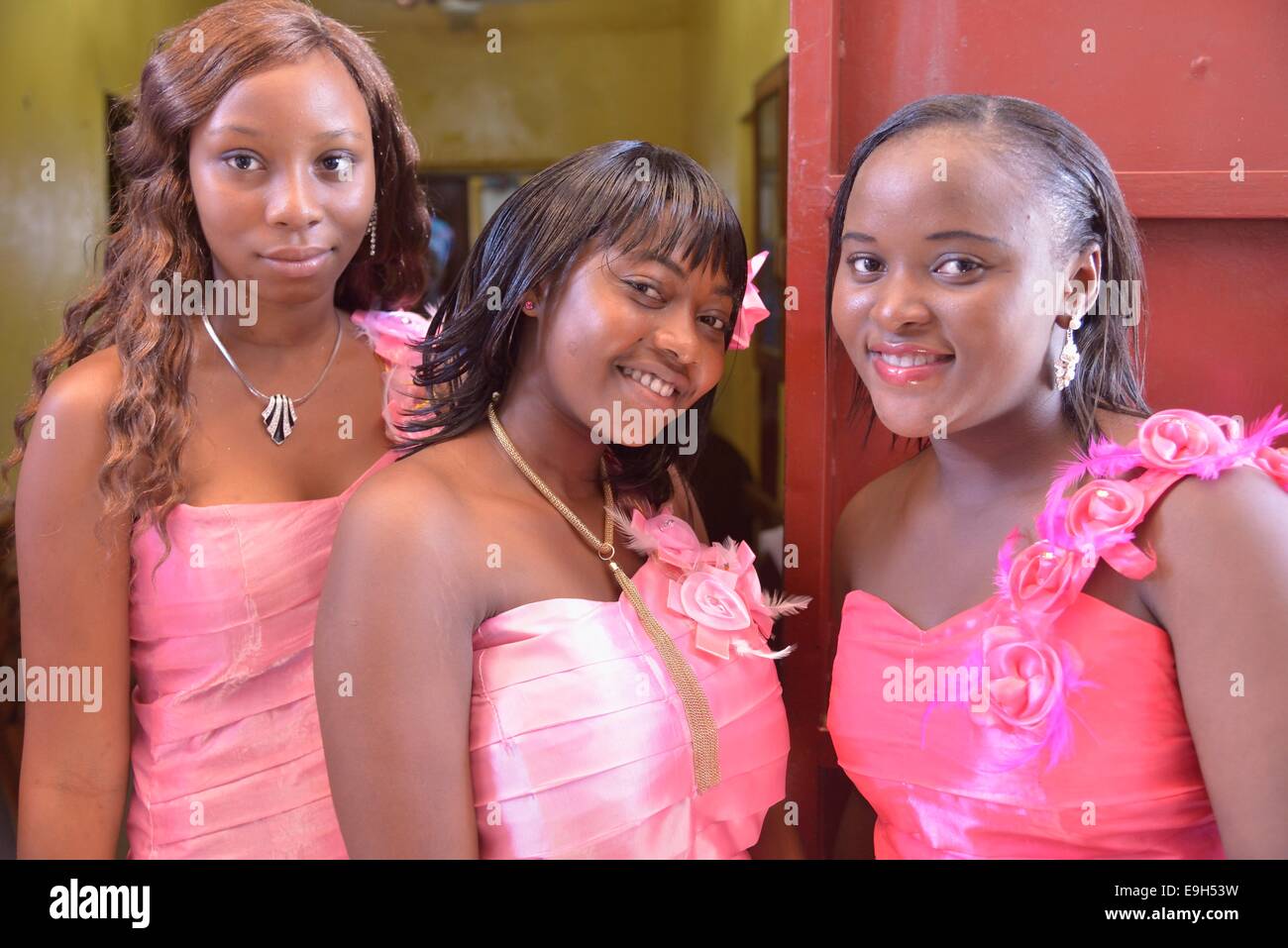 Three ladies in pink dresses at a wedding, 'Pink Wedding', Freetown, Sierra Leone Stock Photo