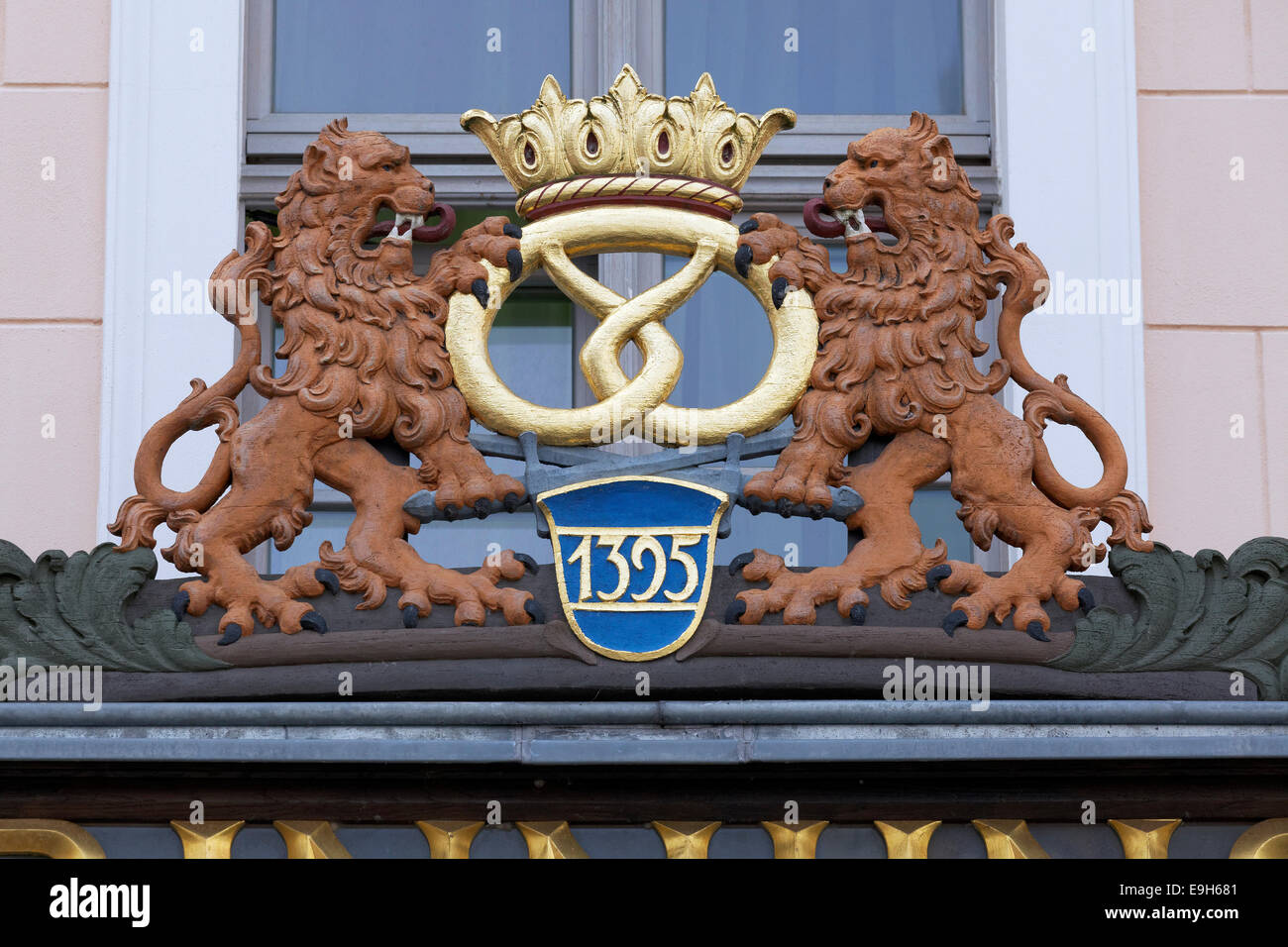 Two lions holding a pretzel, coat of arms on the Haus der Baeckerinnung or the House of Bakers, Görlitz, Saxony, Germany Stock Photo