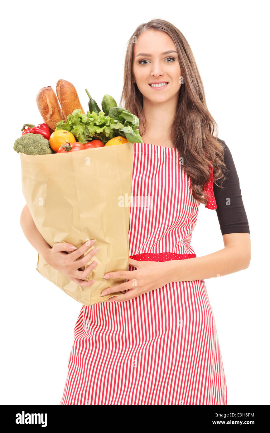 Young housewife holding a grocery bag isolated on white background Stock Photo