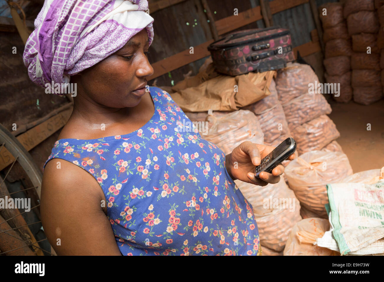 A small business owner on her mobile phone in Dar es Salaam, Tanzania. Stock Photo