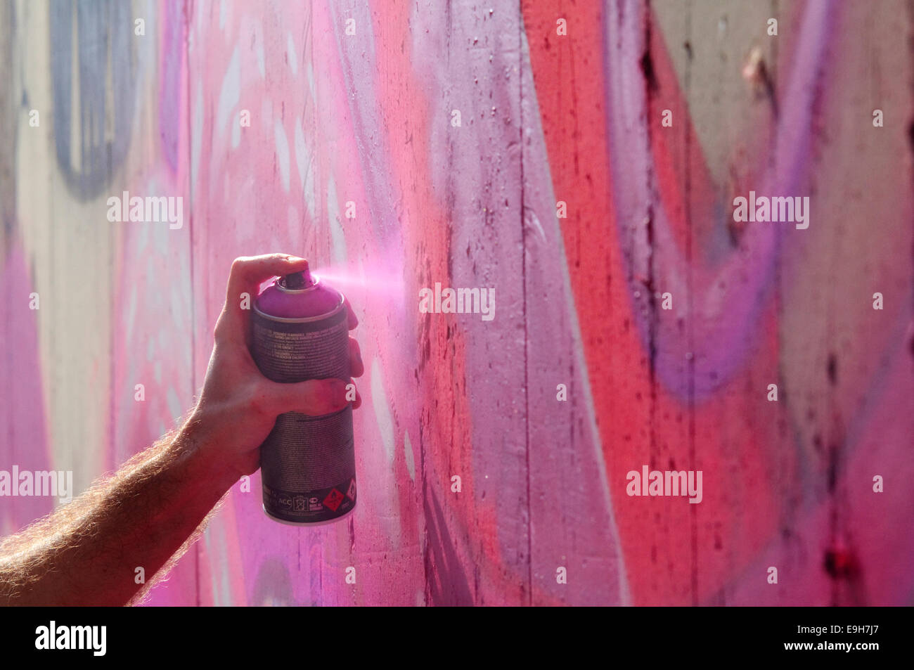 Hand Holding a Spray Can, Graffiti Artist at the Wall Stock Photo - Alamy