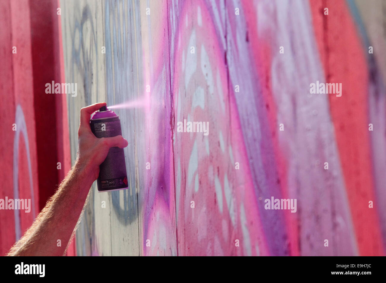 Hand Holding a Spray Can, Graffiti Artist at the Wall Stock Photo - Alamy