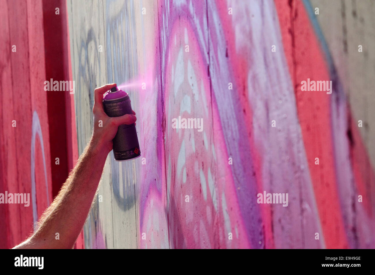 Hand Holding a Spray Can, Graffiti Artist at the Wall Stock Photo - Alamy