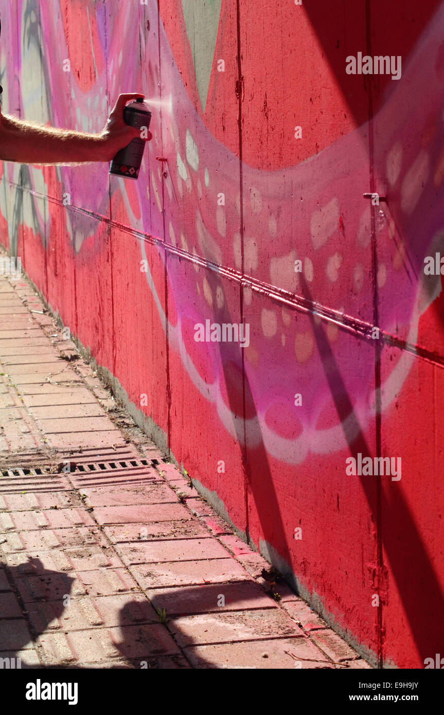 Hand Holding a Spray Can, Graffiti Artist at the Wall Stock Photo - Alamy