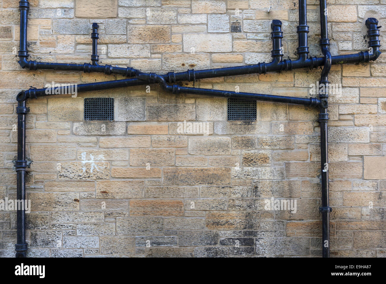 Pipes on a house wall, Edinburgh, Scotland, United Kingdom Stock Photo