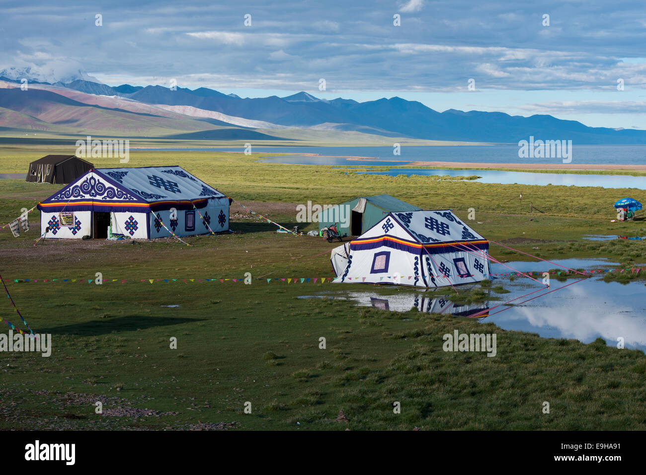 Modern colourful Tibetan picnic tents on the banks of the holy Namtso