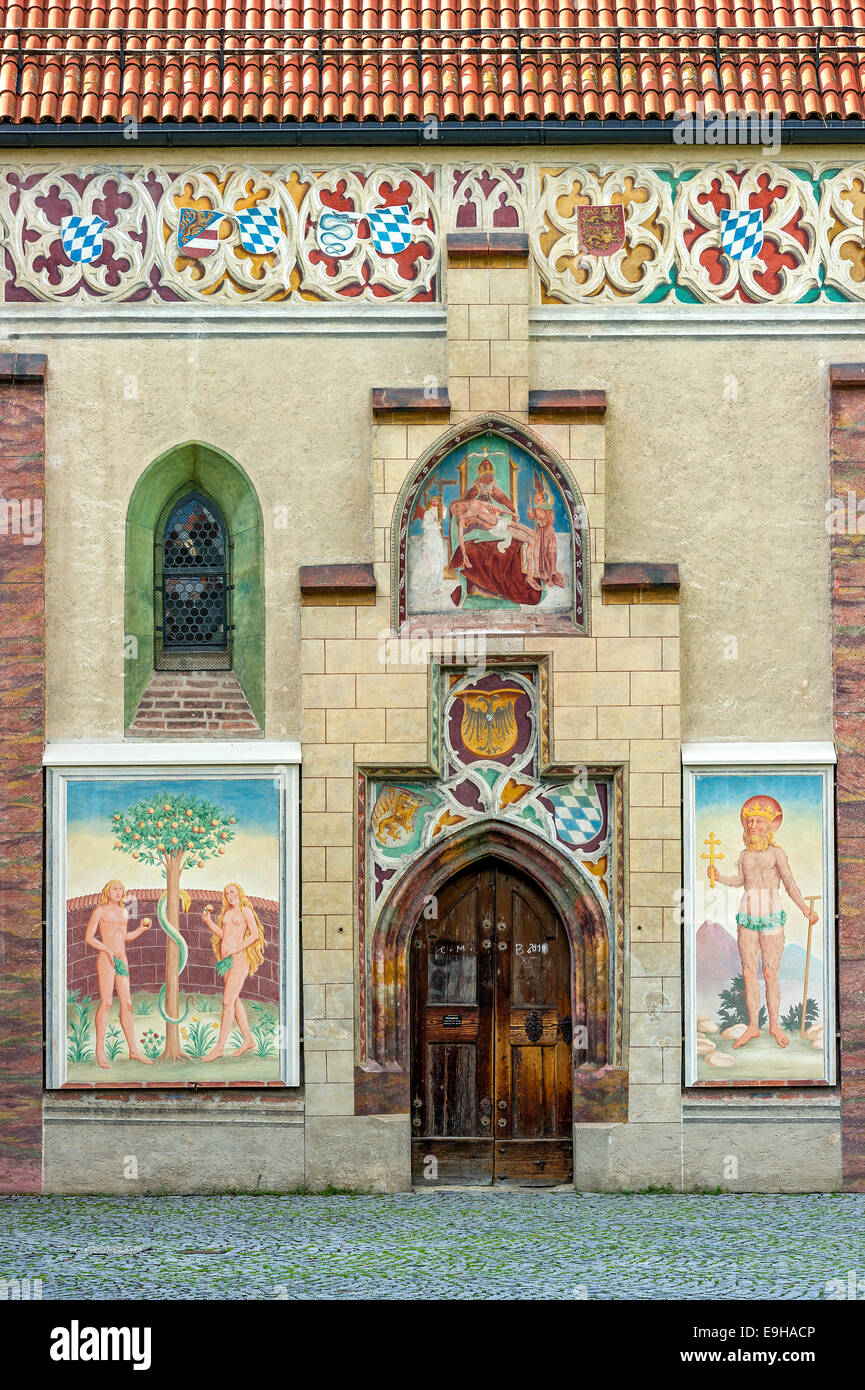 Coat of arms frieze, Gothic frescoes of Adam and Eve and St. Onuphrius, castle chapel in the courtyard of the former moated Stock Photo